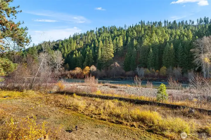 Wonderful river side yard with stone fence