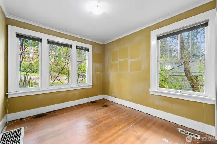 big and bright windows in the main floor bedroom