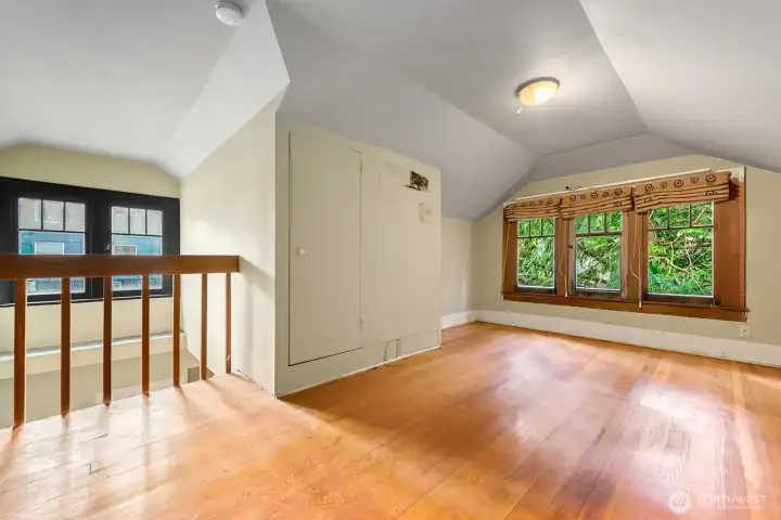 open concept loft overlooking dining room