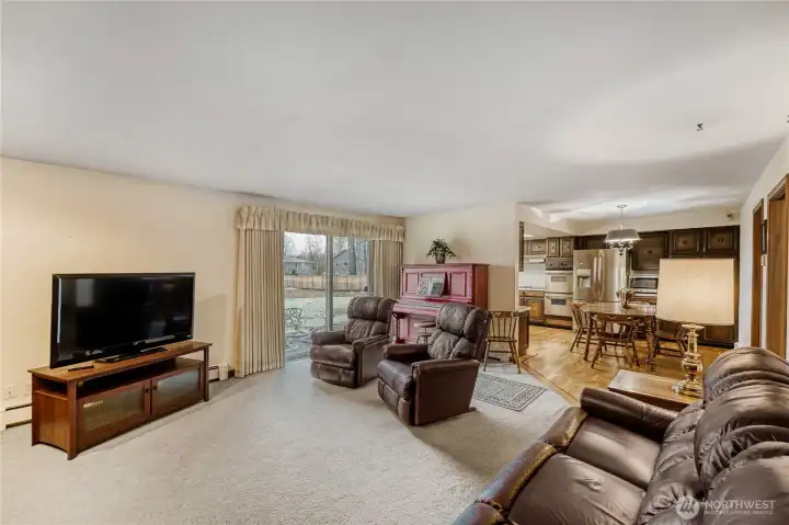 Another view of the family room with access to backyard and kitchen