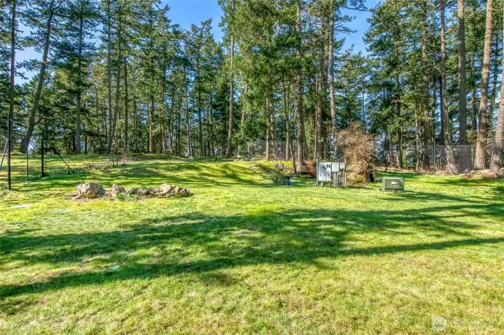 Ridgeline to the west of the house. You have to see this in person to experience the water views and outer islands beyond the trees. The Sellers dreamed of building a main house along this ridge to take advantage of the possibilities with opening up the views to the west. Utilities in place.