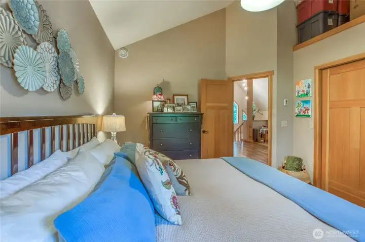 One of two bedrooms looks out to living area, vaulted ceilings and built-ins in the large closet, plenty of storage.