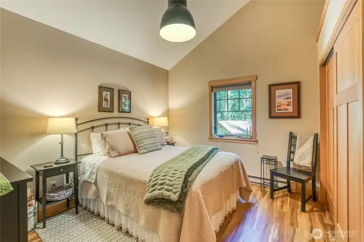 The second bedroom, both bedrooms are very comfortable, have close up views of the forested area surrounding this estate.
