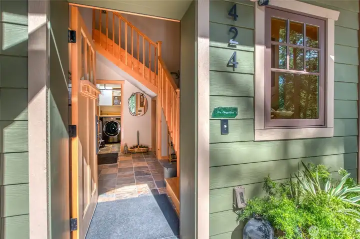 Main level front door opens up to entry, stairway to upper living area, lower bath/laundry and garage.