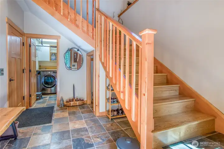 Main level entry, foyer stairs have nighttime lighting.