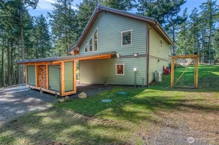Easts end of the residence, shows fenced yard for pets and wildlife exclusion.
