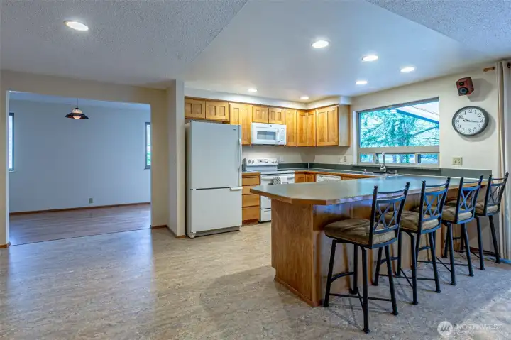 The bonus room, with its window seat, is right next to the kitchen.So inviting!