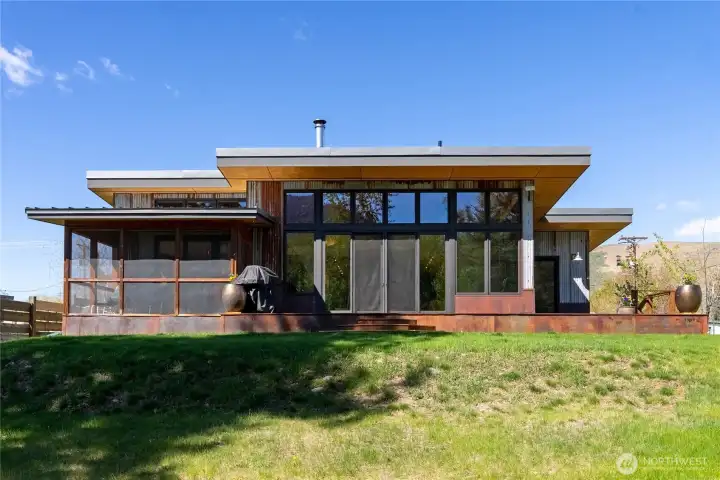 Beautiful modern design with a screened in sun porch, high ceilings and many windows to view the river!