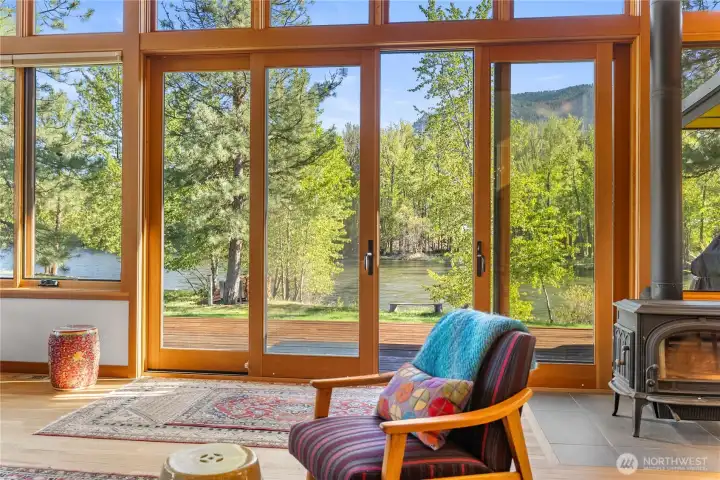 Bath in sunlight to the sounds of the river in this serene modern home.
