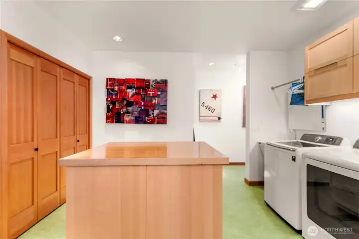 Laundry room, artists table, entry room from the garage.