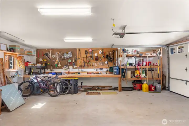 Garage with space for 2 vehicles, a work bench and plenty of storage!