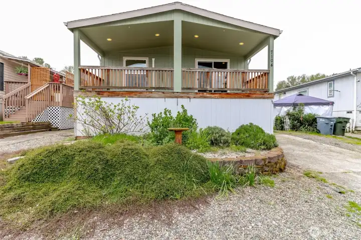 Front of home with full deck across