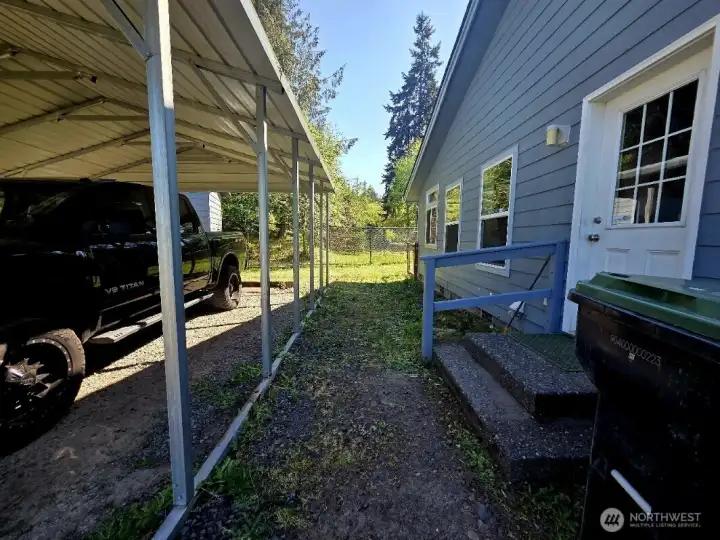 Carport leads directly to laundry room.