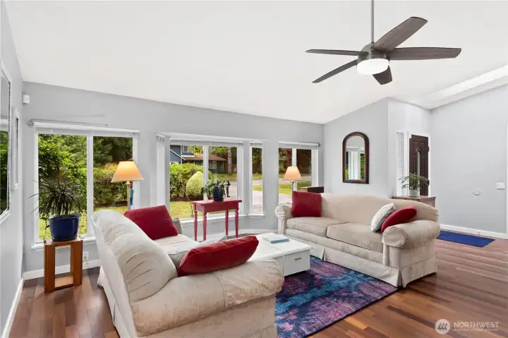 Entry and living room are welcoming. This floor is a Cumaru, a very hard substantiable Brazilian teak, was installed in the entry, LR and DR. It is beautiful!