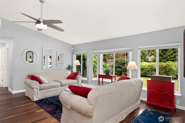Vaulted ceilings make the house feel even more spacious. Large windows let in plenty of light.