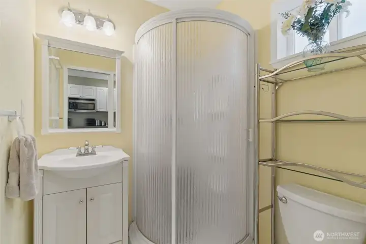 3/4 guest bathroom located off the kitchen.
