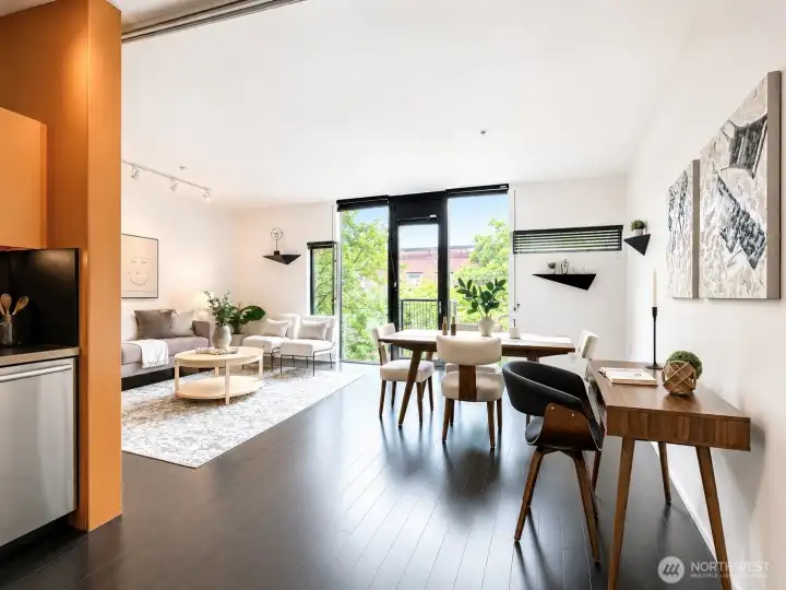 Rich wood tones and dark bamboo floors anchor a living space that balances warmth with urban edge.