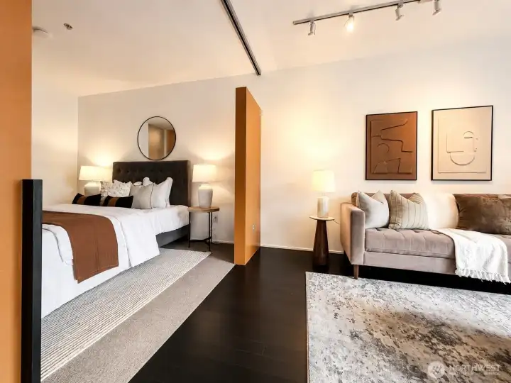 The bedroom reads like a boutique hotel room with warm tones and clean lines.