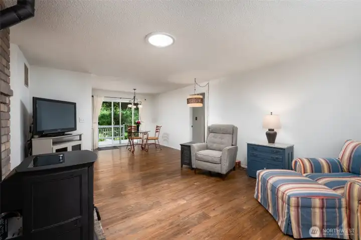 As you enter you will be in your living room which flows nicely into the dining room and remodeled kitchen. Easy access to your backyard and deck. There is also a pellet stove in this living room. As you enter you will be in your living room which flows nicely into the dining room and remodeled kitchen. Easy access to your backyard and deck. There is also a pellet stove in this living room.
