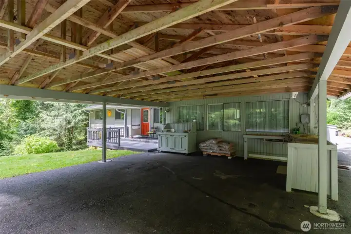 Large two car carport with built in work bench has room for everything! Large two car carport with built in work bench has room for everything!