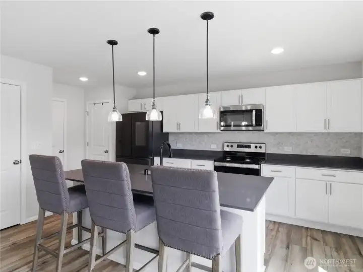 Upgraded lighting, faucet and tile backsplash. Upgraded lighting, faucet and tile backsplash.