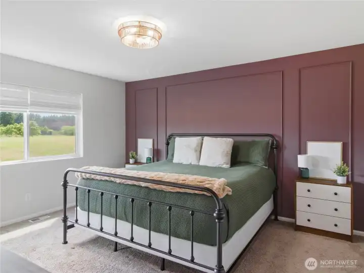 Beautiful accent wall. Peaceful open view out primary bedroom window. Beautiful accent wall. Peaceful open view out primary bedroom window.