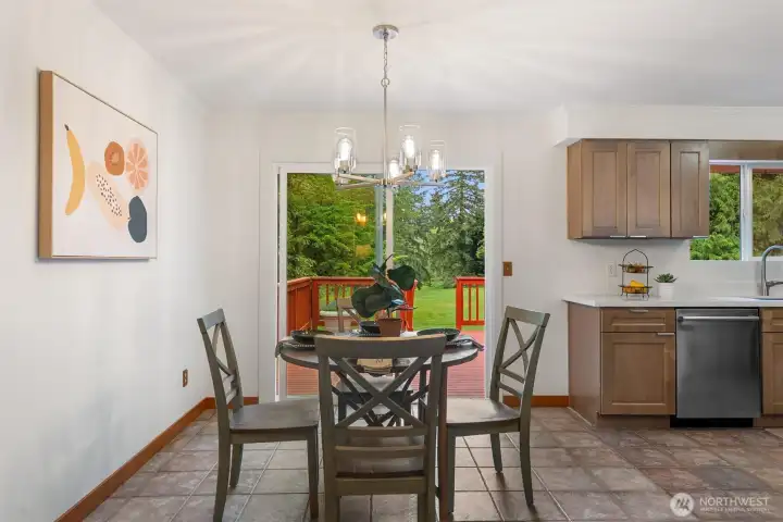 Amply dining space, with views to the beautiful backyard.