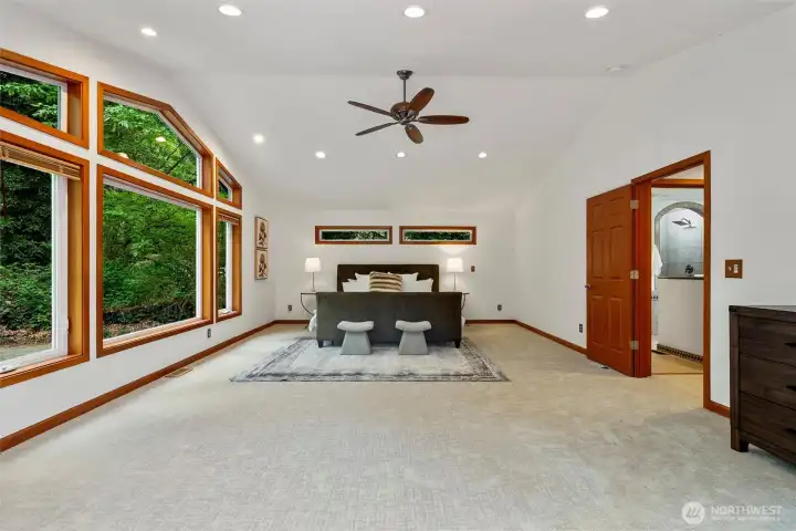 Retreat to the luxurious, spacious primary bedroom, with views to a dreamy backyard.