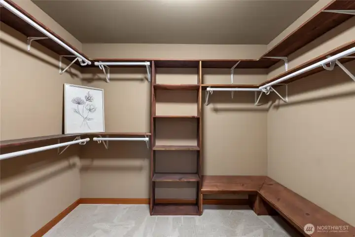 Custom crafted, spacious walk-in closet.