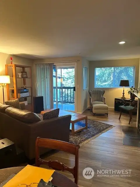 Living area with deck, gas fireplace is to the right