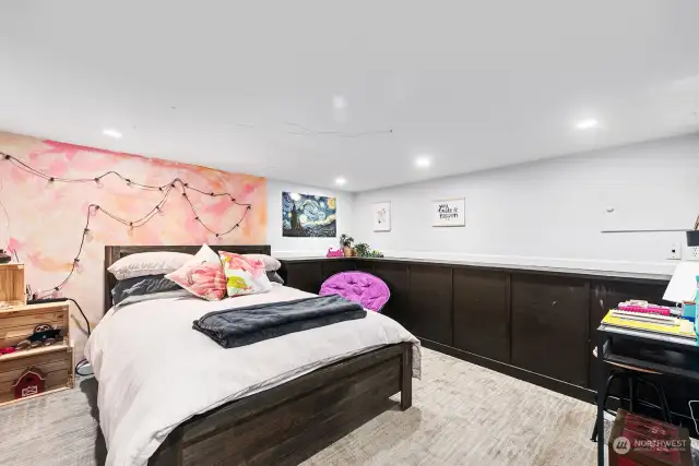 This well-lit downstairs room enjoys the warmth of wall-to-wall carpeting, is spacious and has made an ideal teenager's bedroom, although it is non-conforming.