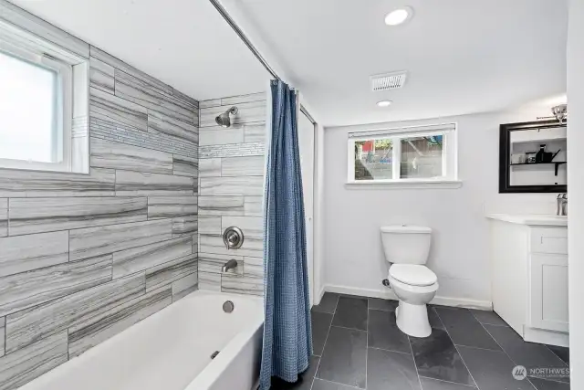 When you are ready to soak in the tub, retreat to the downstairs for a relaxing bubble bath. The tiled full bath has been recently remodeled so everything is new.