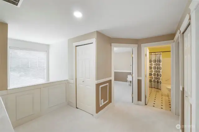 The landing at the top of the stairs overlooks the entry. Natural light fills every room. Full guest bath is centrally located.