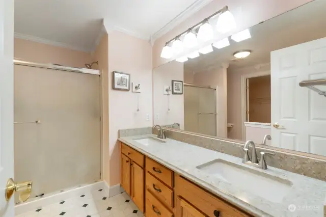 The ensuite bathroom offers dual vanities, walk-in shower, soaking tub and a massive walk-in closet.