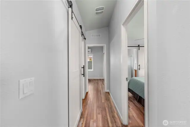 The sellers added barn doors on the guest bathroom and primary bathroom entrances. Made for a better flow and a lot of class!