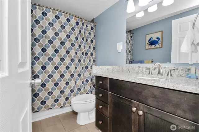 Lower Level Full Bathroom with Tile Shower Surround