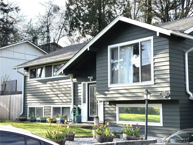Front of Home with Flowers in Bloom