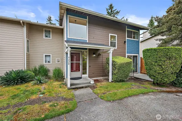 Charming front entrance with a cozy patio area—perfect for enjoying your morning coffee or greeting guests