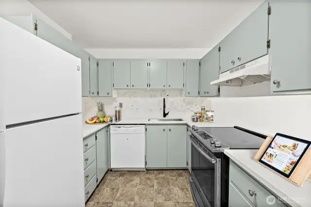 Updated granite countertops with a new kitchen sink, plus a spacious pantry to store all your cooking essentials