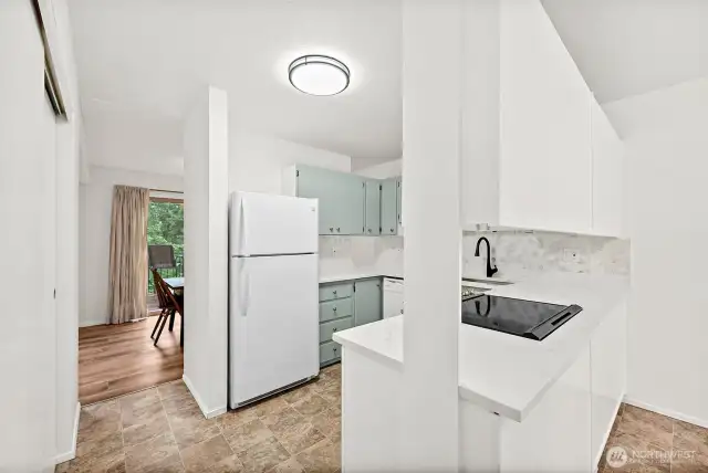 Updated granite countertops with a new kitchen sink, plus a spacious pantry to store all your cooking essentials