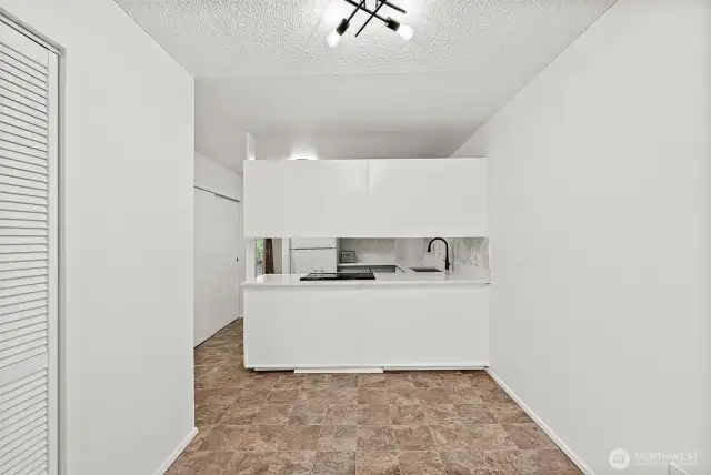 Cozy breakfast bar and additional storage space with easy access to the outdoor patio—ideal for casual dining and entertaining.