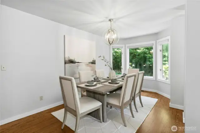Adjacent dining room with a swinging door leading to the kitchen.