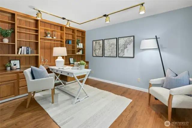 Large main floor office tucked away with great built-ins.