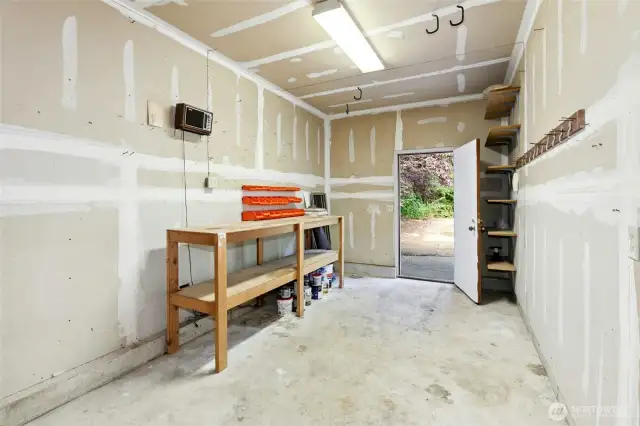 Large shop area in the open garage.