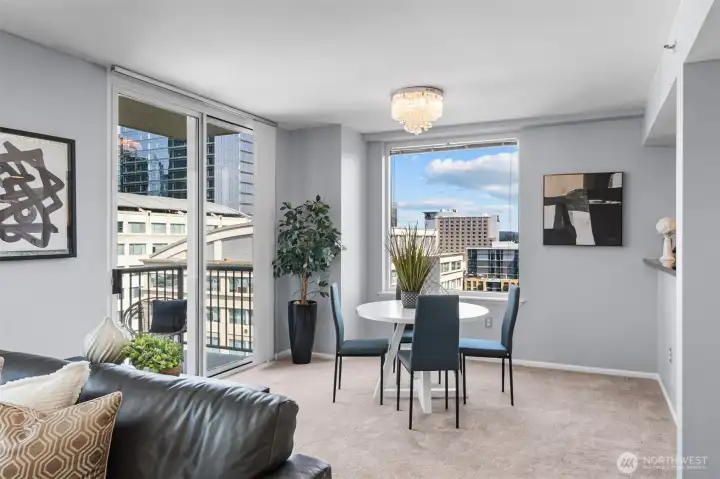 This generous living area provides an open and airy feel, seamlessly connecting to the dining and kitchen spaces.