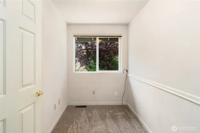 The flex space behind the kitchen could be a half bath or laundry. The washer, dryer and utility sink are behind the wall on the right.