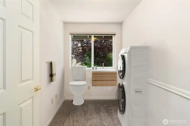 This virtually stages photo shows what could be done with this room. Take off the door and make 2 sliding doors for privacy.
