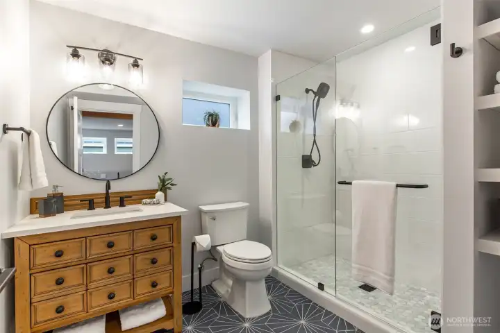 ADU/lower level bath. Laundry is present but not pictured.