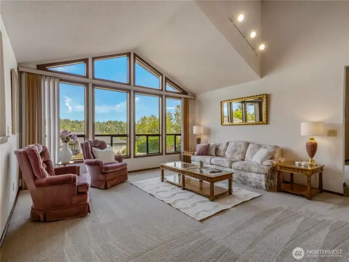 Enter into the beautiful formal living room featuring a marble fireplace.