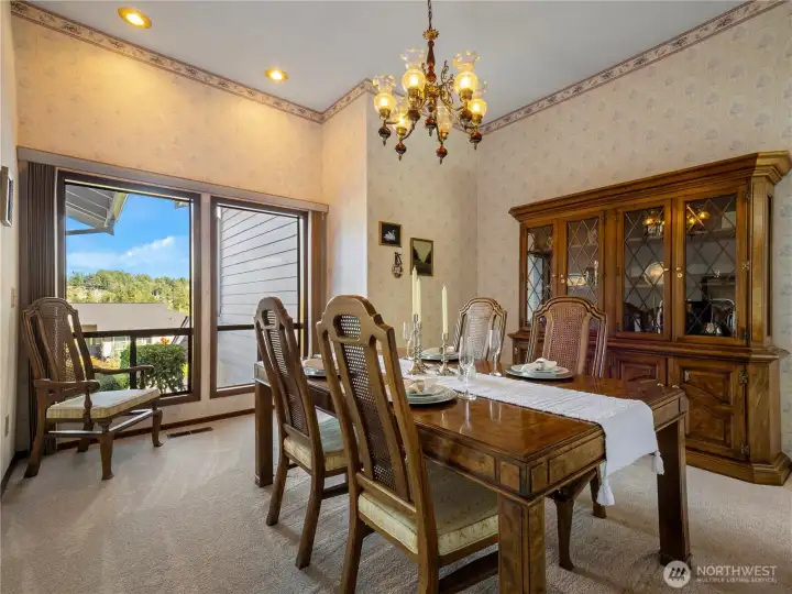 The large formal dining room is located between the living room and kitchen